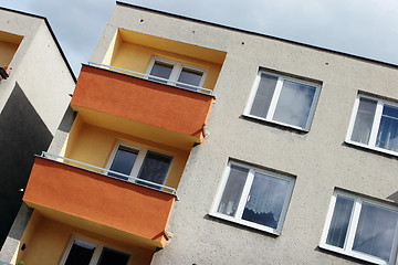 Image showing Detail of orange and yellow prefab house