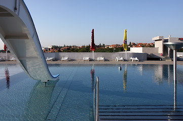 Image showing dispeopled bath pool with white slide