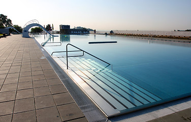 Image showing dispeopled bath pool with white slide