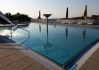 Image showing dispeopled bath pool with white slide