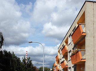 Image showing Detail of orange and yellow prefab house