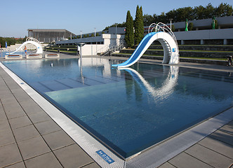 Image showing dispeopled bath pool with white slide