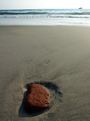 Image showing Red stone in the sand after ebb in Puerto Escondido, Mexico