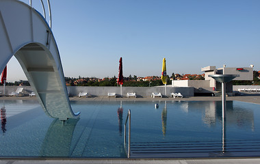 Image showing dispeopled bath pool with white slide