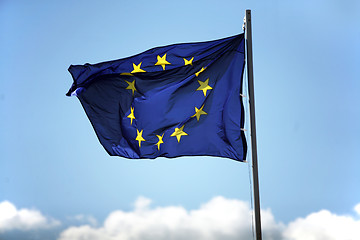 Image showing Blue flag of European Union on the cloudy sky