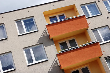 Image showing Detail of orange and yellow prefab house