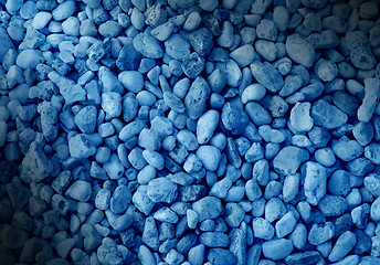 Image showing Smooth blue pebble background dramatically lit.