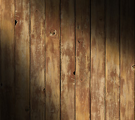 Image showing Distressed wooden surface diagonally lit