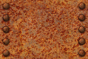 Image showing Rusted metal surface with rivets