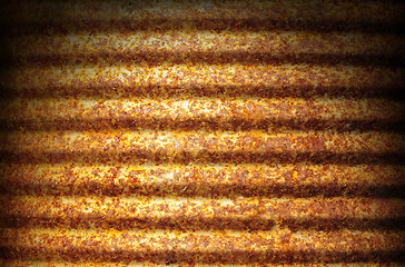 Image showing Rusty corrugated metal surface lit dramatically