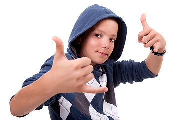 Image showing boy with his hands rise up as a sign of everything cool