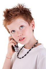 Image showing cute boy on the phone,looking up