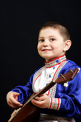 Image showing Smiling boy with balalaika