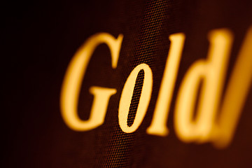 Image showing gold on black. inscription