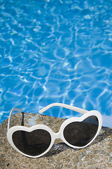 Image showing Sunglasses by the Pool