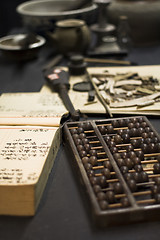 Image showing abacus and book on the table 