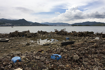 Image showing Garbage piled up on the coast of the ocean. 