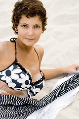 Image showing woman lying on a sand