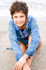 Image showing woman in blue dress on the beach