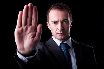Image showing Businessman with his hand raised in signal to stop