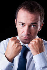 Image showing Businessman punching fist: sign of competition