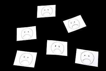 Image showing sad faces, isolated on black