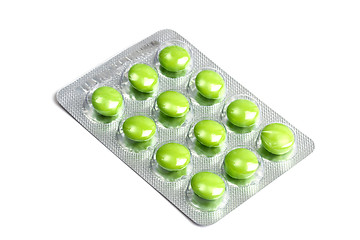 Image showing Package of green pills isolated on white 