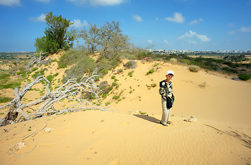 Image showing Boy among the sand