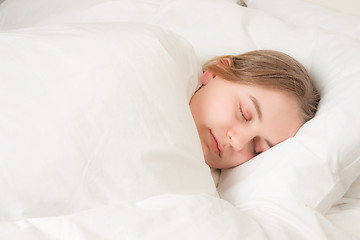 Image showing young woman asleep in bed