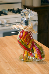 Image showing Decorative Glass Hen filled with Garlic and Peppers