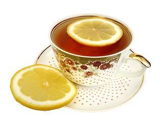 Image showing A cup of tea and slices of lemon
