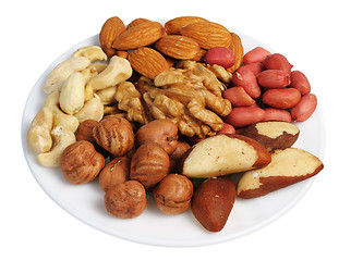 Image showing Set of nuts on a white plate, isolated