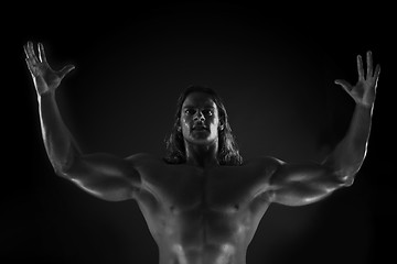 Image showing  Dramatic image of a beautifully sculpted bodybuilder