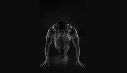 Image showing  Dramatic image of a beautifully sculpted bodybuilder