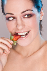 Image showing Image of beautiful girl holding strawberry