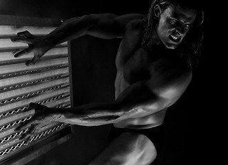 Image showing  Dramatic image of a beautifully sculpted bodybuilder