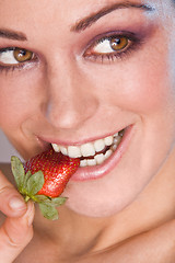 Image showing Image of beautiful girl holding strawberry