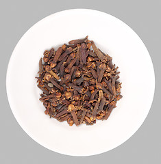 Image showing Heap of clove on white plate