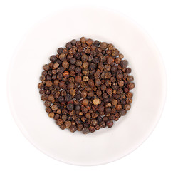 Image showing Heap of black pepper on white plate