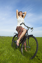 Image showing Girl with a bicycle