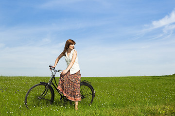 Image showing Girl with a bicycle