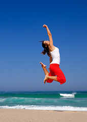 Image showing Young woman jumping