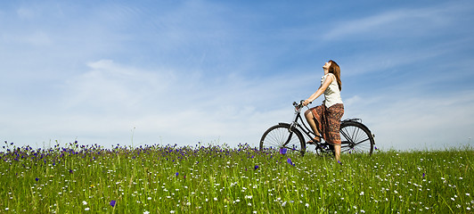 Image showing Girl with a bicycle