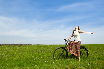 Image showing Girl with a bicycle