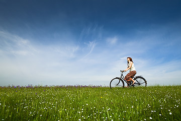 Image showing Riding a bicycle