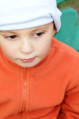 Image showing Kid in orange closeup