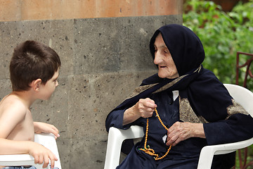 Image showing Kid chatting with granny