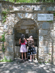 Image showing Two girls drink at the spring of Meryemana (Virgin Mary's House)