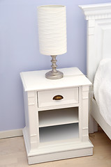 Image showing Bedside table with lamp