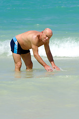 Image showing Senior man in water